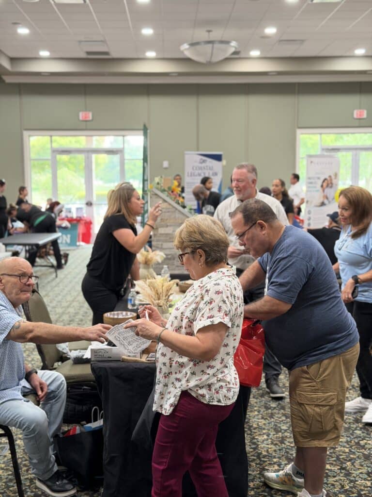 Guests browsing vendor tables in the event hall